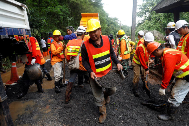 Rescue workers are seen near Tham Luang cave complex, as members of under-16 soccer team and their coach have been found alive according to a local media's report, in the northern province of Chiang Rai, Thailand, July 3, 2018. REUTERS/Soe Zeya Tun