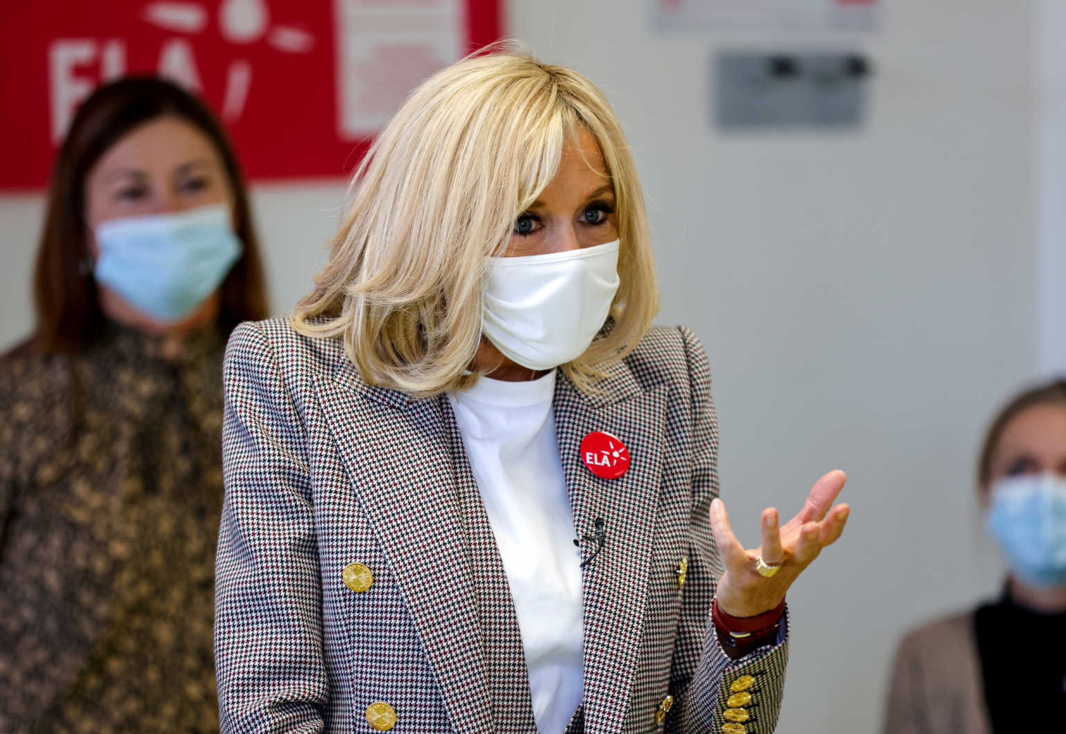 Brigitte Macron gives a dictation to school children in support for the European Leukodystrophy Association (ELA), at a school in Paris, France October 12, 2020. Thomas Coex/Pool via REUTERS