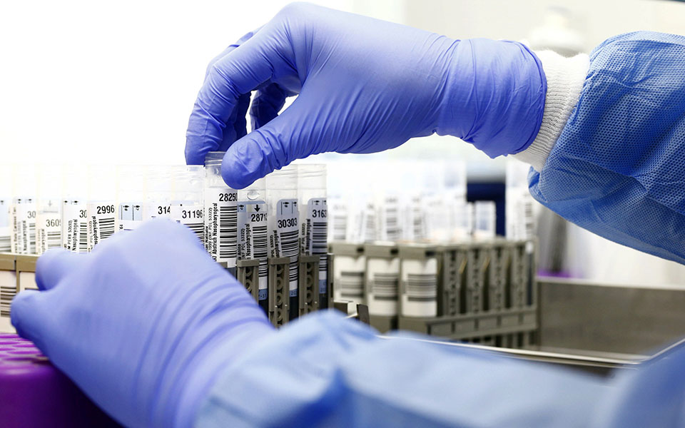 Laboratory technician Simone Ferrari-Fidel prepares tubes containing swab samples to be tested for COVID-19 at the University Hospital Zurich (USZ), as the spread of the coronavirus disease (COVID-19) continues, in Zurich, Switzerland November 19, 2020. Picture taken November 19, 2020.       REUTERS/Arnd Wiegmann