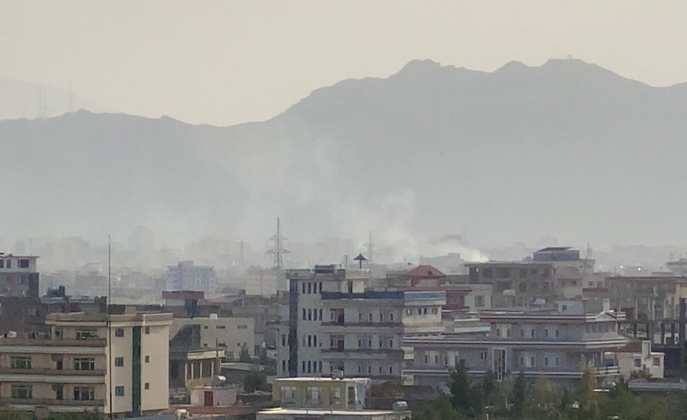 epa09435191 Smoke billows at the scene following an explosion near the Hamid Karzai International Airport, in Kabul, Afghanistan, 29 August 2021. The process of withdrawing the 5,000 United States military personnel deployed to Kabul's airport for the evacuation of Americans and Afghan allies is under way in the face of "very real" threats of additional attacks such as the one two days ago that left some 200 people dead, the Pentagon said 28 August. More than 117,000 people have departed from the Kabul airport since the "massive military, diplomatic, security and humanitarian undertaking" began following the fall of the capital to the Taliban on Aug. 15.  EPA/STRINGER