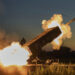 A Russian TOS-1A Solntsepyok heavy flamethrower rocket launcher, captured by the Ukrainian army battalion "Da Vinci", fires towards the Russian positions on the frontline near Kreminna, Luhansk region, Ukraine, Friday, July 7, 2023. Writing on its body reads "Da Vinci", a code name of the battalion commander Dmytro Kotsiubaylo, who was killed in battle. (AP Photo/Libkos)