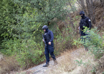 Kosovo police officers patrol an area near Banjska Monastery during a ongoing police operation in the village of Banjska on Monday, Sept. 25, 2023. Kosovo on Monday observed a day of mourning for the Kosovar Albanian police officer killed by Serb gunmen who then barricaded themselves in an Orthodox monastery in a siege that further raised tensions as the two wartime foes seek to normalize ties. In the north, where most of Kosovo’s ethnic Serb minority lives in four municipalities around Mitrovica, police were patrolling in search of the armed assailants after they left the monastery. (AP Photo/Visar Kryeziu)